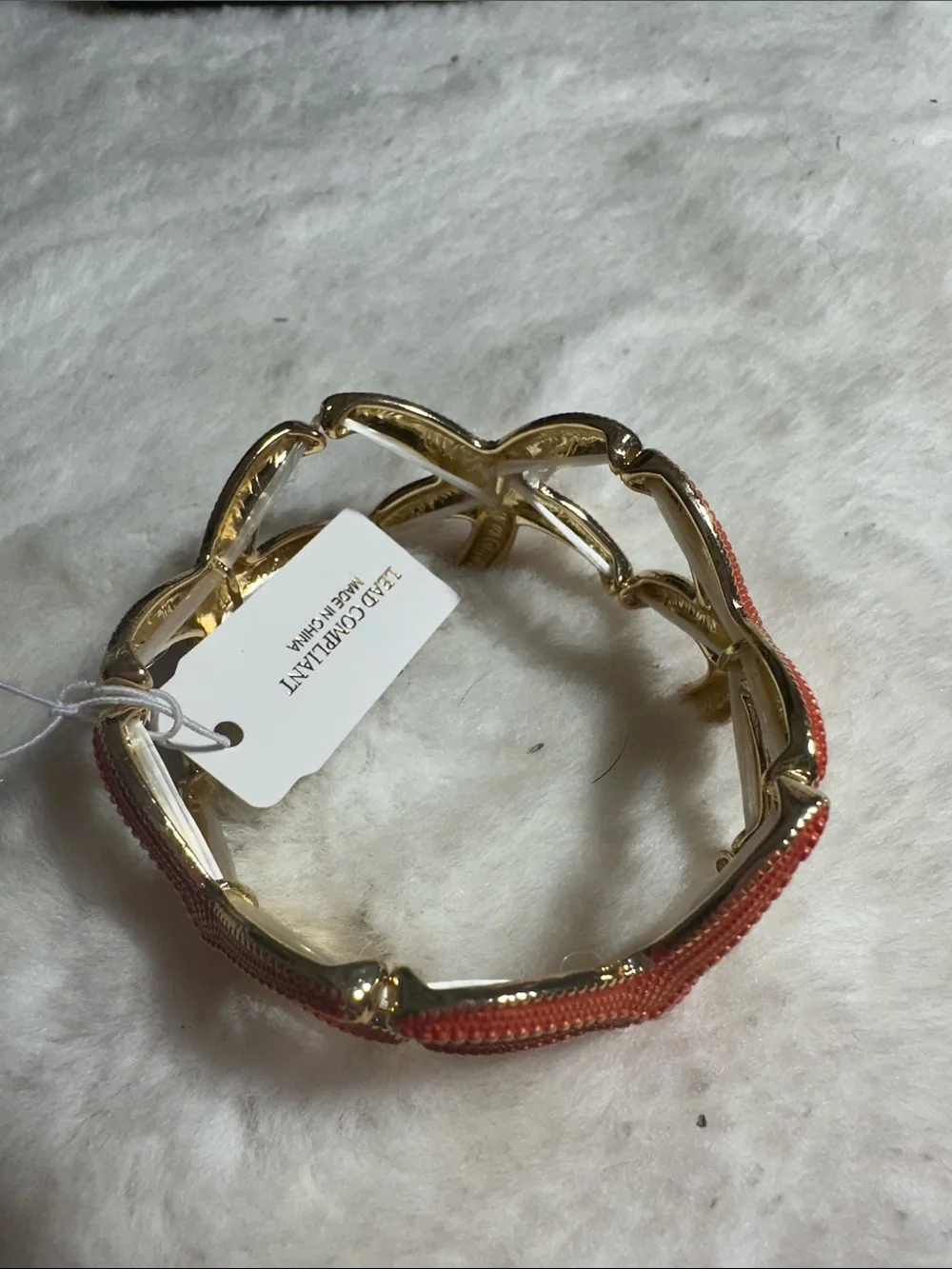 Natasha orange starfish stretchy gold bracelet